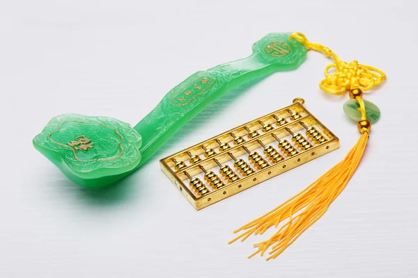 Abacus and jade ruyi with background — Stock Photo, Image