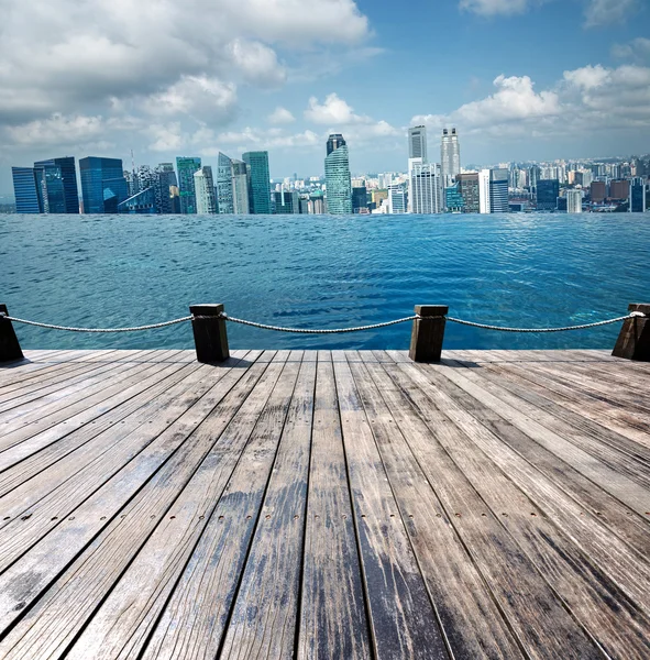 Swimming pool and scene of city — Stock Photo, Image