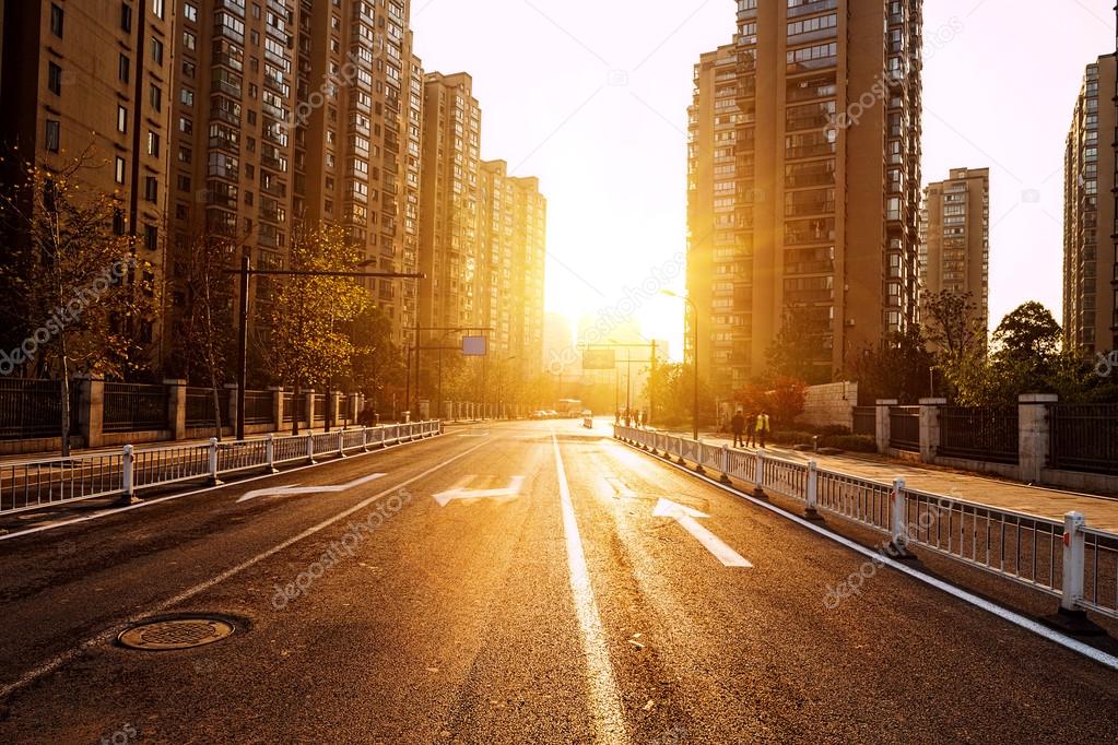 Road and buildings with sunset