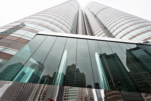 Modern glass silhouettes of skyscrapers in the city — Stock Photo, Image