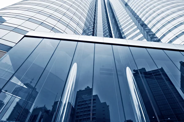 Modern glass silhouettes of skyscrapers in the city — Stock Photo, Image