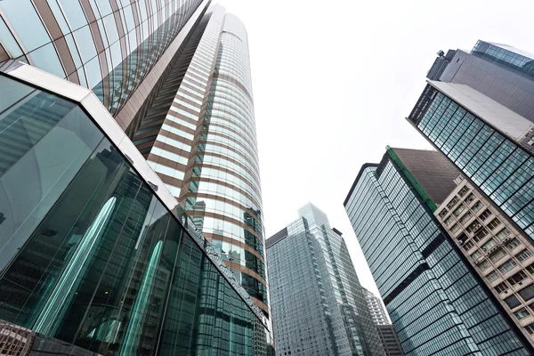 Modern glass silhouettes of skyscrapers in the city — Stock Photo, Image