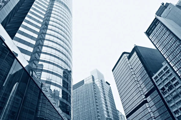 Modern glass silhouettes of skyscrapers in the city — Stock Photo, Image