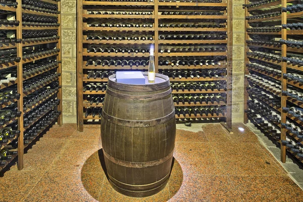 Wine cellar with wine bottle and glasses — Stock Photo, Image