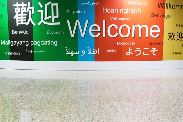 Various languages of welcome in a wall — Stock Photo, Image