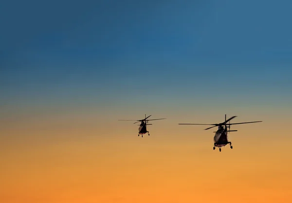 Silhouette of two helicopters — Stock Photo, Image