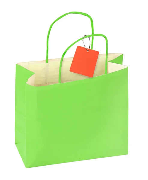 Bolsa de compras verde y etiqueta de precio en blanco —  Fotos de Stock