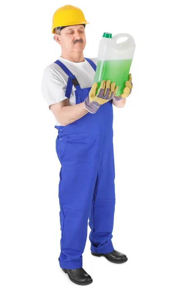 Manual worker with green liquid — Stock Photo, Image