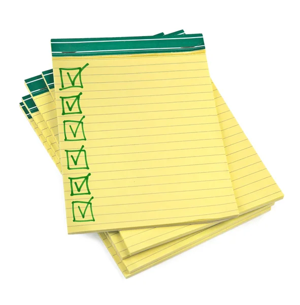 Cuadernos de papel forrado con lista de verificación completada —  Fotos de Stock