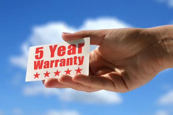 Card with five year warranty inscription — Stock Photo, Image
