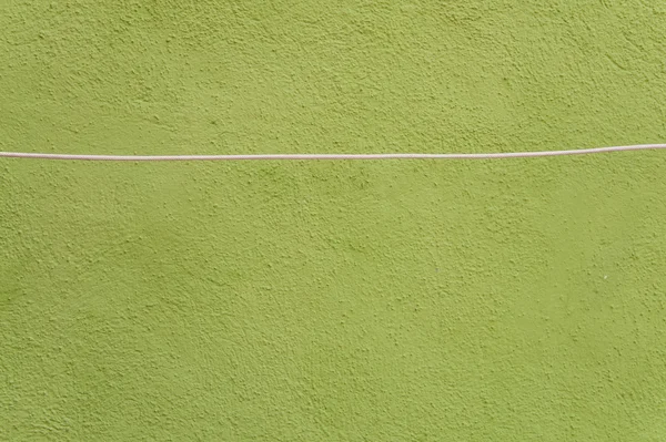 Grunge groene muur met touw — Stockfoto