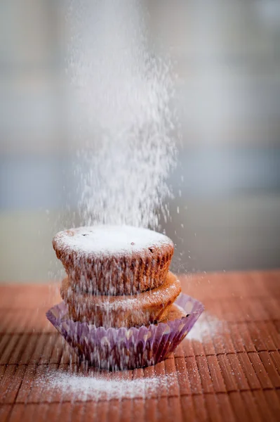Muffin with sugar falling — Stock Photo, Image