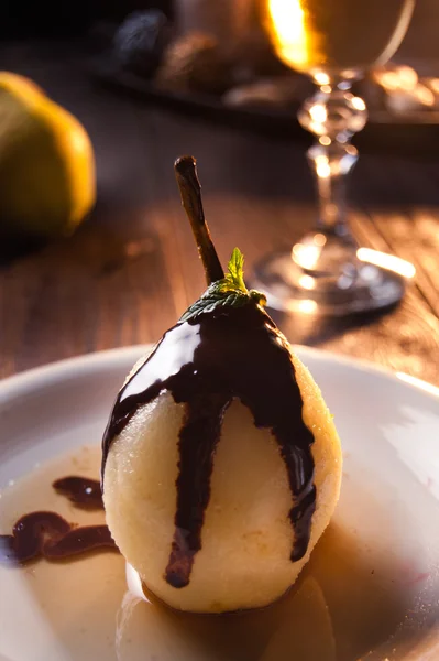 Delicious pear dessert with chocolate and amaretto liqueur — Stock Photo, Image