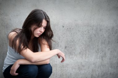 Teenage girl looking thoughtful about troubles clipart