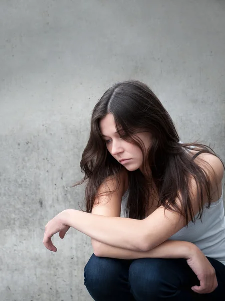 Teenage girl looking thoughtful about troubles — Stock Photo, Image