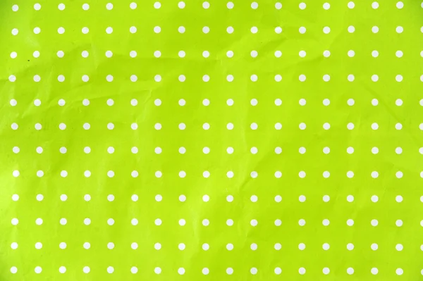 Papier vert lime à pois blancs Photo De Stock