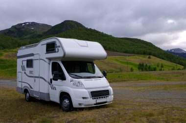 Motorhome/ camper going on vacation over Scandinavia clipart