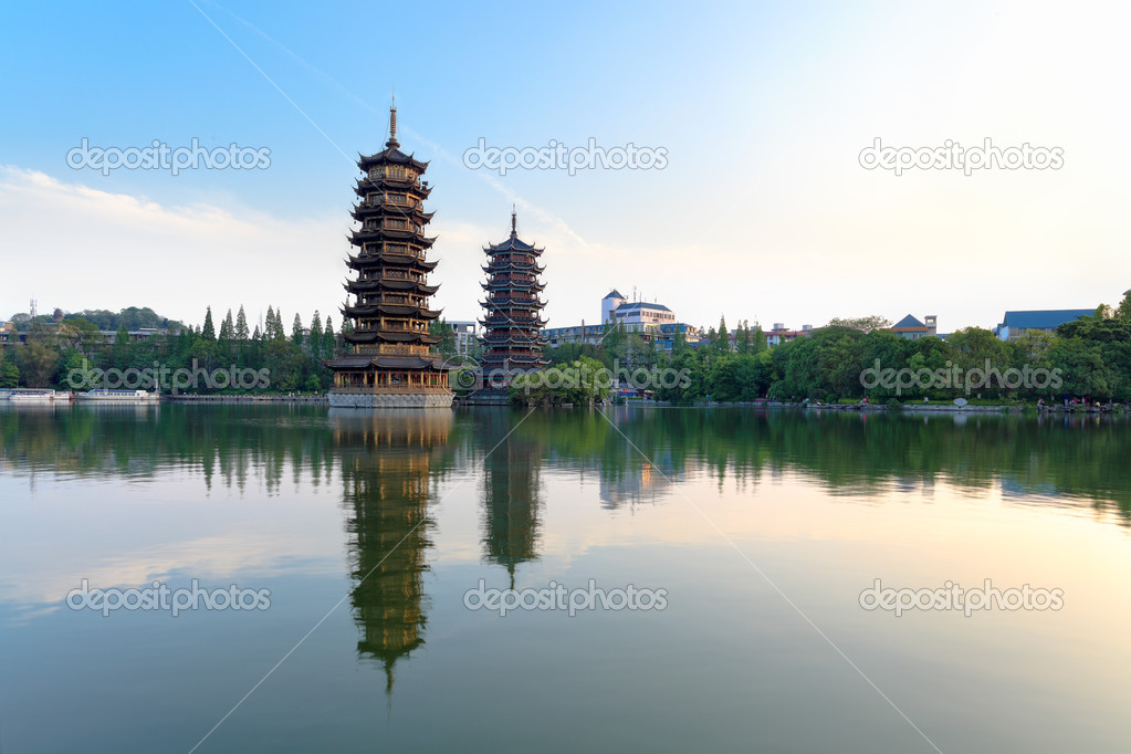 Twin pagodas in banyan lake