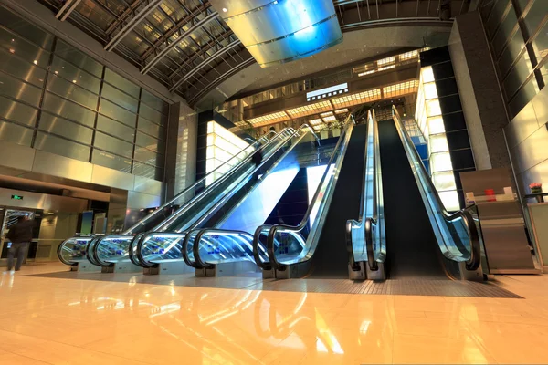 Modern escalators in lobby — Stock Photo, Image