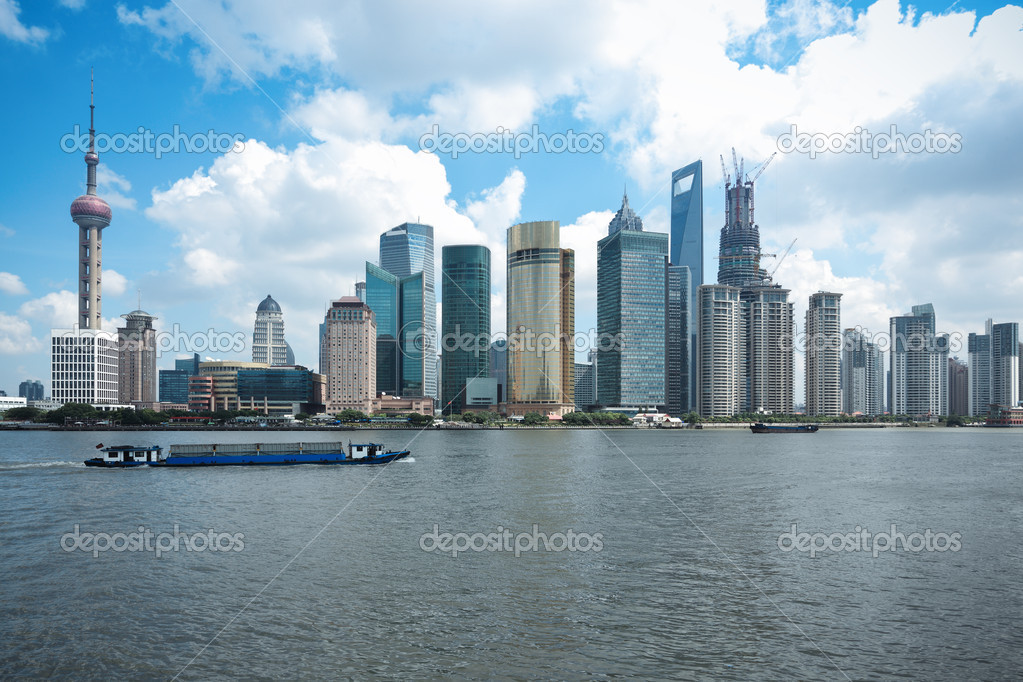 Shanghai skyline with cargo ship