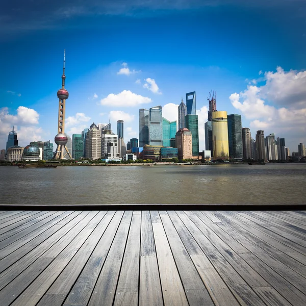 Shanghai skyline with wooden floor — Stock Photo, Image