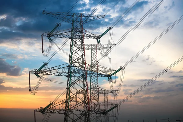 High voltage transmission pylon at dusk — Stock Photo, Image