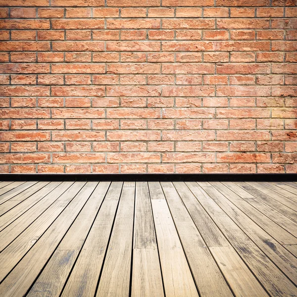 Brick wall and wooden floor — Stock Photo, Image