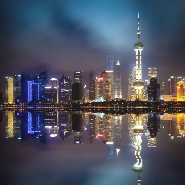 Shanghai pudong skyline with reflection at night — Stock Photo, Image