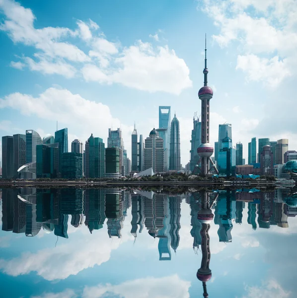 Cityscape of modern city with reflection in shanghai — Zdjęcie stockowe