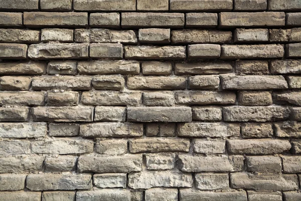 Weathered grey bricks wall — Stock Photo, Image