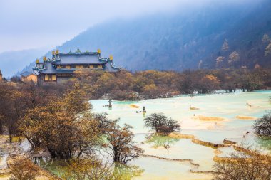 huanglong scenery with travertine pond clipart