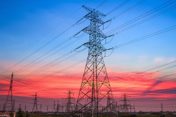 Electricity pylon in sunset — Stock Photo, Image