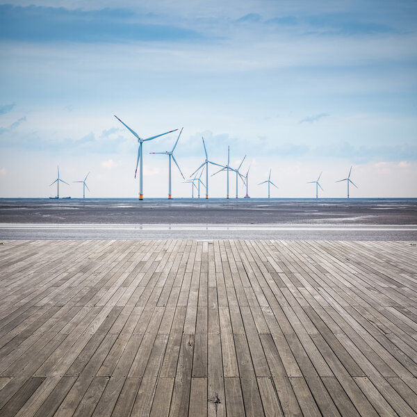 wind farm in mud flat with wooden floor
