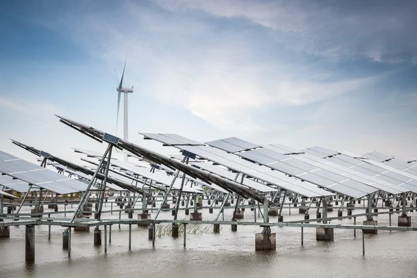 Solar and wind power in coastal mud flat — Stock Photo, Image