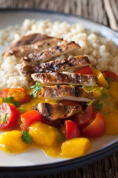 Healthy Thinly Sliced Grilled Chicken Breast with Rice and Tomato Cilantro Mango Salad