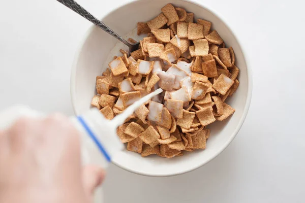 Pouring Milk Cinnamon Toast Crunch Cereal — стоковое фото