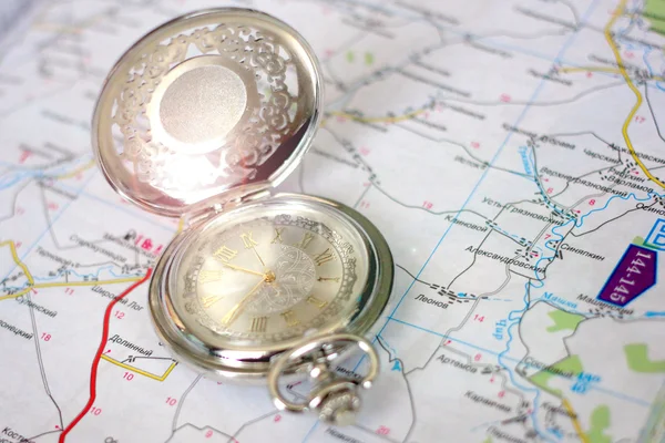 Old clock and geographical map — Stock Photo, Image