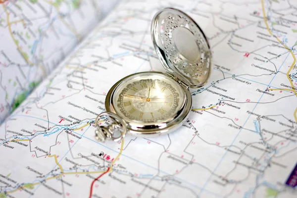 Old clock and geographical map — Stock Photo, Image