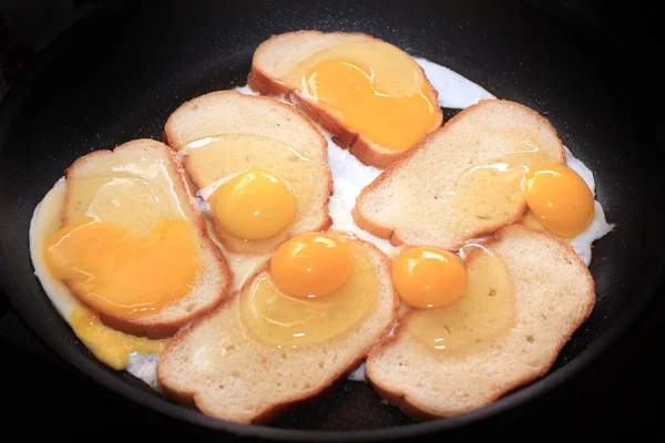 Fried eggs and fried bread — Stock Photo, Image