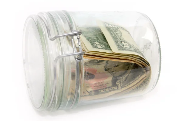 Dollars in a glass container — Stock Photo, Image