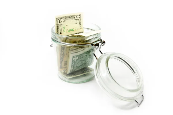 Dollars in a glass container — Stock Photo, Image