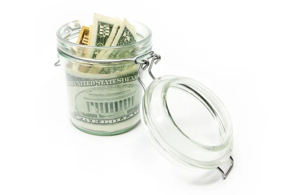 Dólares en un recipiente de vidrio —  Fotos de Stock