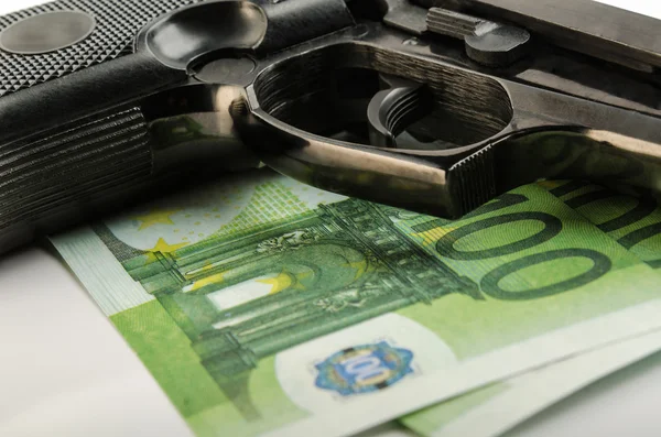 Gun and money — Stock Photo, Image
