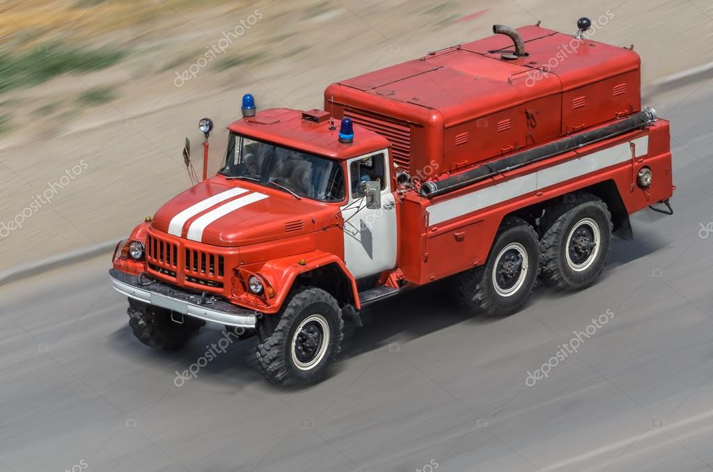 Fire car moving on the road (all logos, inscriptions and markings removed)