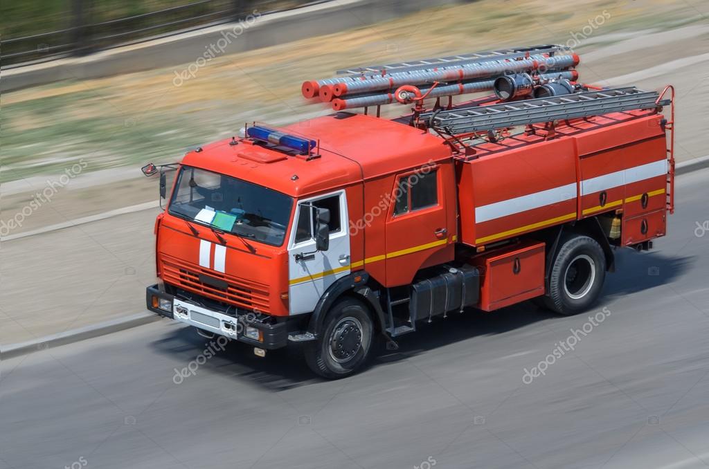 Fire car moving on the road (all logos, inscriptions and markings removed)