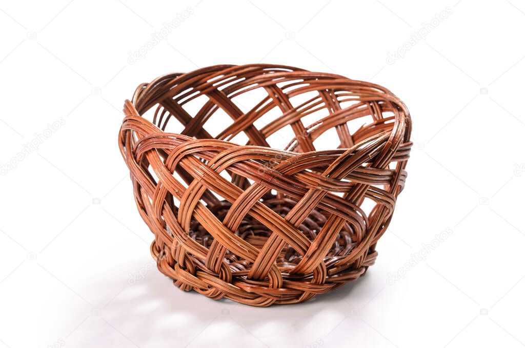 decorative wicker basket on a white background with soft shadow