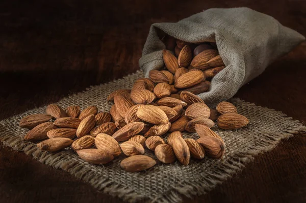 Almonds Woven Bag Dark Wooden Background Stock Photo