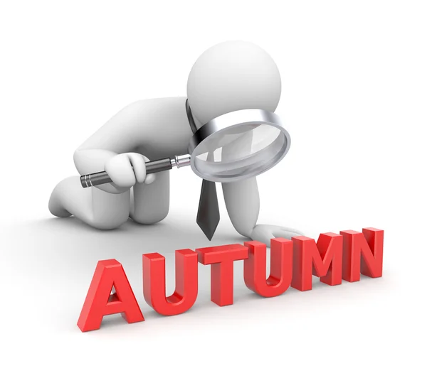 Businessman examines something word Autumn — Stock Photo, Image
