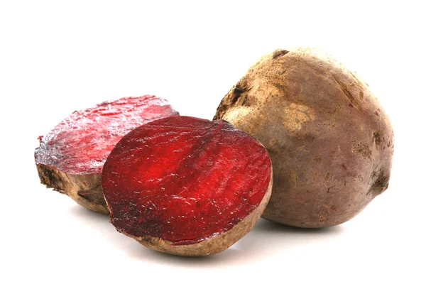 Two whole beetroots also called red beet on white background one cut — Stock Photo, Image
