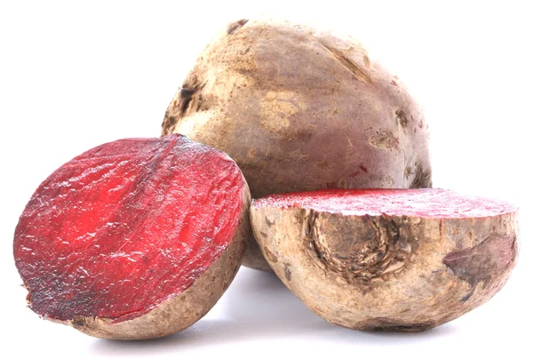 Two whole beetroots also called red beet on white background one cut in half — Stock Photo, Image